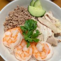 Dry Hu Tieu · Rice noodles served with chicken, shrimp, ground pork, house-made fish cake, cucumbers and c...