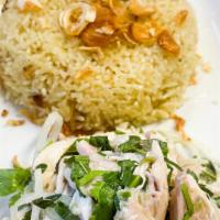 Hoi An Chicken Rice · Shredded free-range chicken mixed with pickled red onion and rau ram served over turmeric ch...