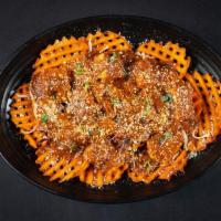 Sexy Fries · An Indian-inspired poutine - sweet potato fries topped with cheese and choice of protein
