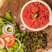 5. Kitfo · Finely chopped lean flank steak, seasoned butter, spices, and served with homemade cottage c...