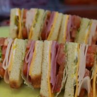 34-Ham Turkey Club Sandwich · Cheese, mayonnaise, mustard, lettuce, tomato, onion, and pickle.