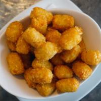 Tater Tots · Perfectly fried tater tots dusted with our secret spices.
