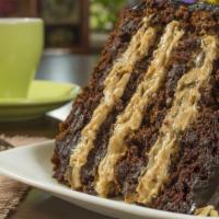 S'more Cake · Bring the campfire home with this chocolate cake, with a gingerbread crust, giant marshmallo...