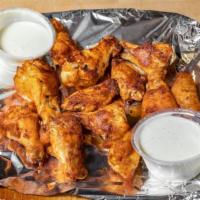Buffalo Wings · One dozen crispy wings. Served with ranch or blue cheese dressing.