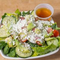 Chopped Salad · Mixed greens, crumbled blue cheese, avocado, cucumbers, grape tomatoes and your choice of dr...