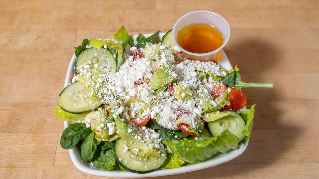 Chopped Salad · Mixed greens, crumbled blue cheese, avocado, cucumbers, grape tomatoes and your choice of dressing.