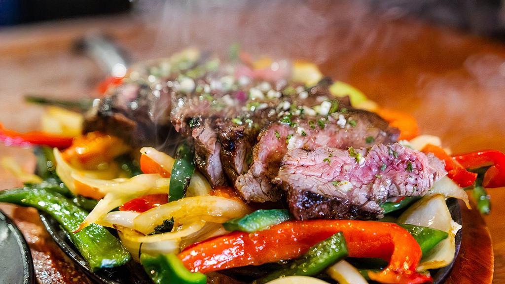 Fajitas · Choice of Mary's Chicken, Beef, Shrimp, grilled peppers and onions/fresh herb chimichurri