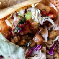 Fish Tacos (2) · Pineapple salsa / house made creme / Rancho slaw / lime
 pink beans / rice
