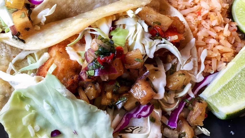 Fish Tacos · 2 flour tortillas filled with grill or fried  fish, lettuce, pico de gallo, onions and chipotle mayonnaise served with French fries
