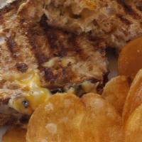 Country Grilled Cheese Sandwich · Our country bakers loaf slices with cheddar, swiss, and fontina cheese all melted to perfect...