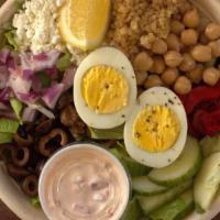 Mediterranean Salad Bowl · Quinoa, goat cheese, cucumber, garbanzo beans and olives on arugula and spinach.