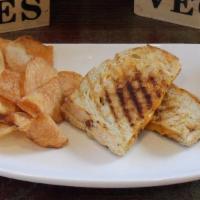 Kids Grilled Cheese · Our country bakers loaf slices stuffed with cheddar cheese toasted to perfection served with...