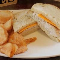 Kids Turkey & Cheese Sandwich · Sumano's bakery garlic rosemary sourdough spread with mayo, topped with freshly sliced turke...