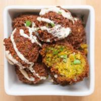 Falafels · 9 falafels made with fried chickpeas, herbs and spices. Served with sauce.