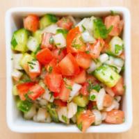 Israeli Salad · Chopped tomato, cucumber, and onion.