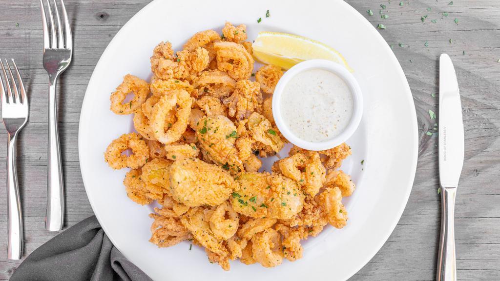 Fried Calamari · With fried green beans and artichokes served with lemon caper aioli and homemade cocktail sauce.