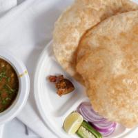 Chole Bhature (2) · 2 pieces of Fluffy fried bread (all purpose flour) with chickpea curry.