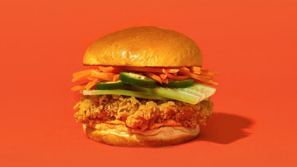 Banh Mi · Our signature fried chicken served on a toasted bun and topped with shredded carrot slaw, cilantro, jalapenos, cucumbers, and spicy mayonnaise.
