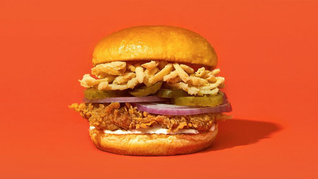 Double Onion · Our signature fried chicken served on a toasted bun and topped with crispy fried onions stirings, pickles, fresh cut onions, and creamy ranch.