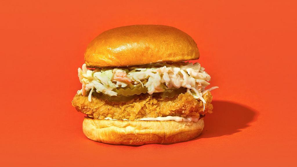 The Og · Our signature fried chicken served on a toasted bun and topped with coleslaw, pickles, and mayonnaise.