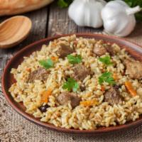 Beef Fried Rice · Fried rice, scallions, soy sauce and egg with fresh veggies and beef.