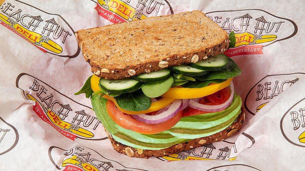 Vegan Vibes · Avocado, vegan mayo, vegan smoked gouda, tomatoes, onions, cucumbers, bell pepper & spinach on toasted sliced wheat.