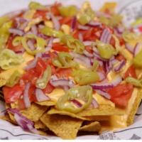 Classic Nachos · Tomatoes, onions, & pepperoncinis.
