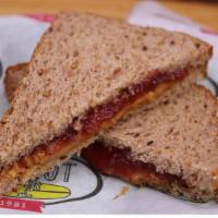 P.B. & Jellyfish · Chunky peanut butter and strawberry jam on sliced wheat.