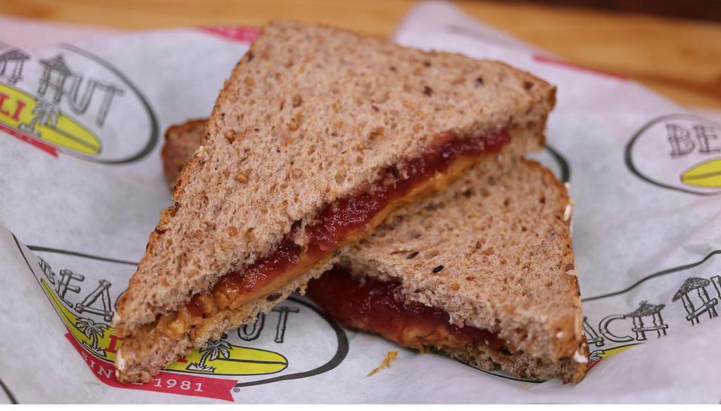 B. & Jellyfish · Chunky peanut butter and strawberry jam on sliced wheat.