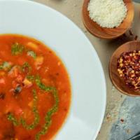 Hearty Minestrone Soup · Tomato broth with vegetables, pasta & pesto drizzle