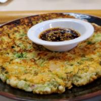 Seafood Pancake · Korean style par-fried pancake with seafood and green onion.
