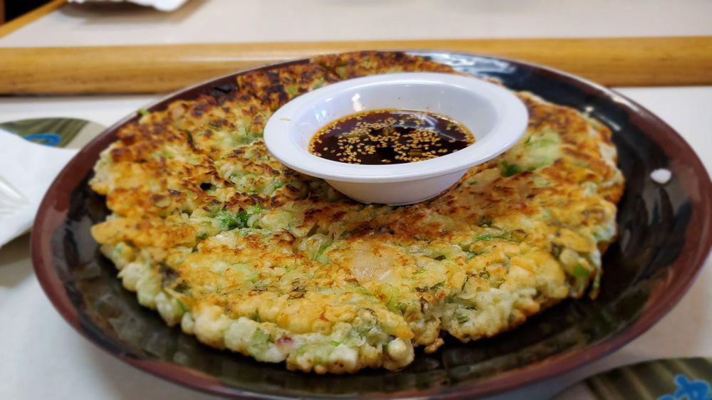 Seafood Pancake · Korean style par-fried pancake with seafood and green onion.