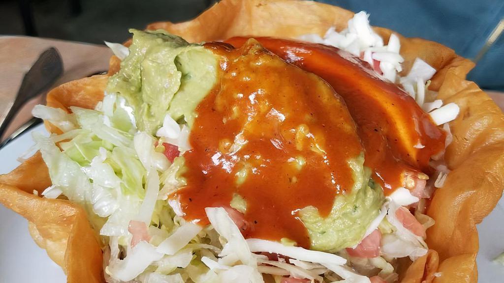 Taco Salad · Choice of meat, rice, fried beans, sour cream, cheese, lettuce, tomato and guacamole.