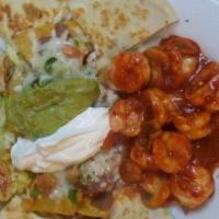 Palillo Plate · Cheese quesadilla, nachos with cheese, sour cream, guacamole, taquitos (chicken or beef), Me...