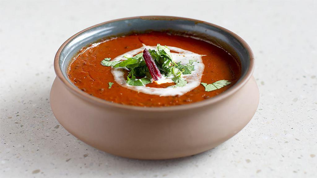*Dal Makhani · Chef recommended. Gluten-free, nut-free. Mild.  a harmonious blend of black lentil,  red kidney beans,  tomatoes, ginger and finished with cream and butter.