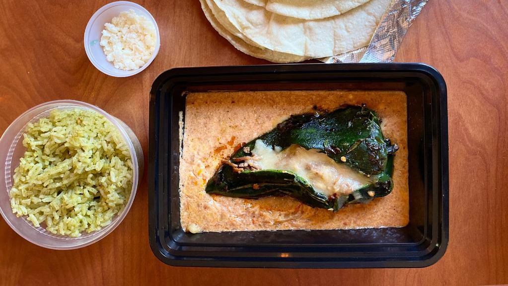 Chile Relleno · Grilled poblano pepper stuffed with jack cheese and choice of filling. Served with creamy chipotle sauce, 2 oz. of queso fresco and 8 oz. of arroz verde.