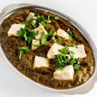 Saag Paneer · Cubes of homemade cheese with spinach and spices.