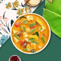 Yellow Curry Chicken · Yellow curry chicken simmered with tomatoes, potatoes, coconut milk and sweet onion. Mild.