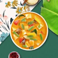 Yellow Curry Tofu · Yellow curry tofu simmered with tomatoes, potatoes, coconut milk and sweet onion. Medium.