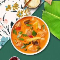Curry On Panang (Tofu) · Crispy tofu simmered in panang curry, coconut milk, bell pepper and peas.