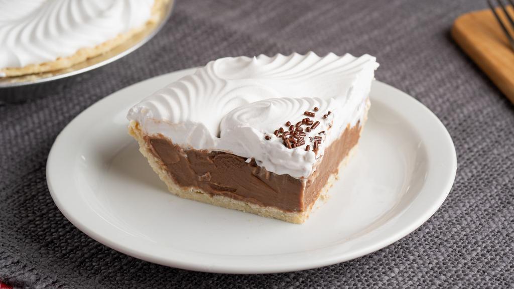 Chocolate Crème (Slice) · Guittard chocolate bars melted with cream inside a flakey pie crust. Topped with whipped topping.