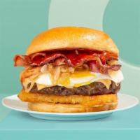 Meat Lovers Breakfast Burger · Eggs with beef burger, crispy bacon, caramelized onions, melted cheese, and hash brown.
