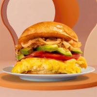 The Andrea Breakfast Sandwich · Eggs with melted cheese, caramelized onion, tomato, and avocado.