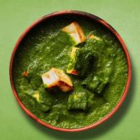 Spinach Veggie Paneer · Indian cottage cheese cooked with fresh spinach an Indian herbs and spices and cream.