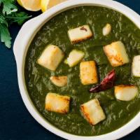 Saag Paneer Curry · Cooked with Spinach, Tomato Gravy, Cottage cheese with garlic and spices.
