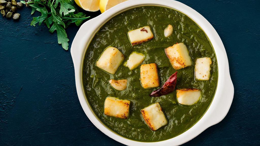Saag Paneer Curry · Cooked with Spinach, Tomato Gravy, Cottage cheese with garlic and spices.