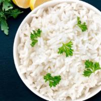 White Rice · Long grain Basmati Rice cooked with Light cumin for flavor