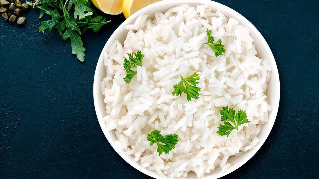 White Rice · Long grain Basmati Rice cooked with Light cumin for flavor