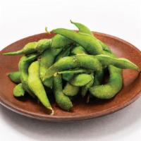Edamame · Steamed green soybeans served with either spicy garlic or furikake seasoning.