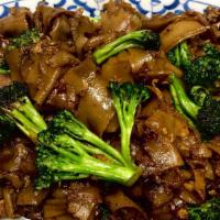 PAD SEE EWW · Pan-fried wide rice noodles with egg, garlic, and broccoli with choice of meat.
